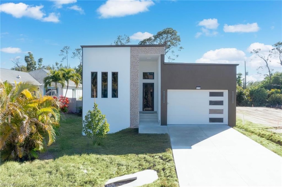 Modern home with a garage and a front yard