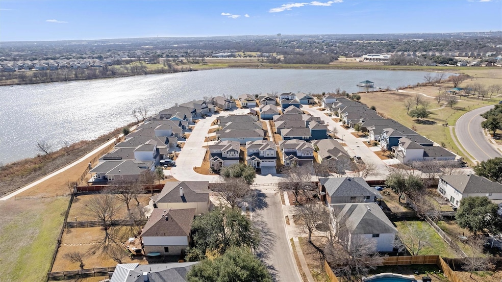 Aerial view with a water view and a residential v