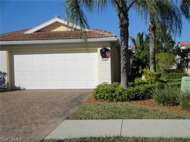 Entrance to property with paver brick driveway.