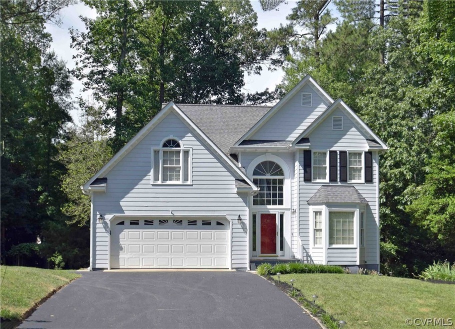 Newly paved double wide driveway provides addition