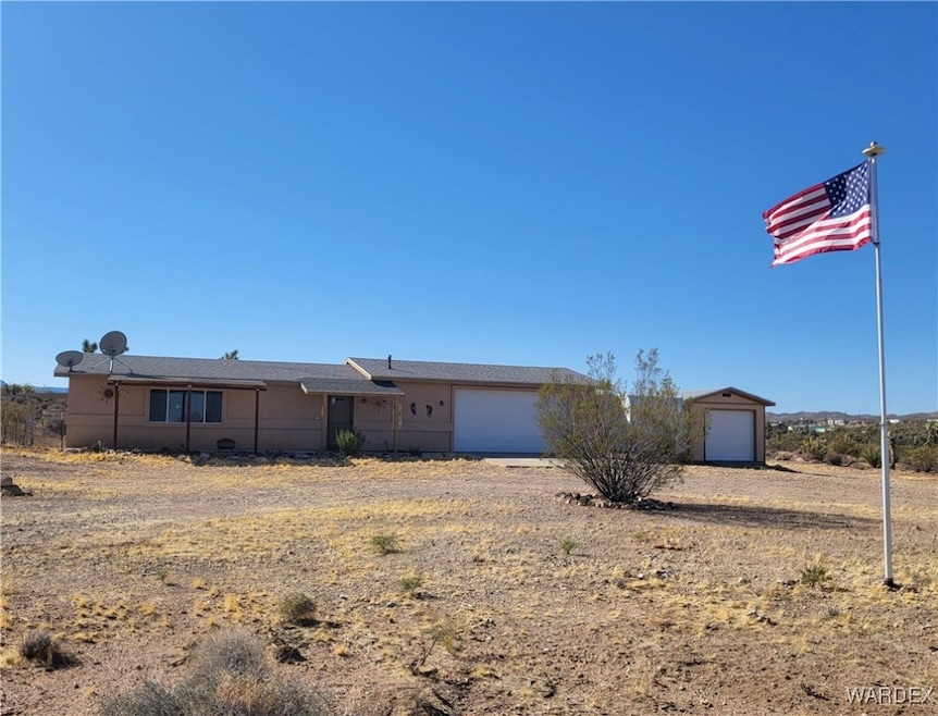 Ranch-style house featuring a garage