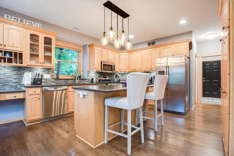 Gorgeous kitchen with center island, honed granite