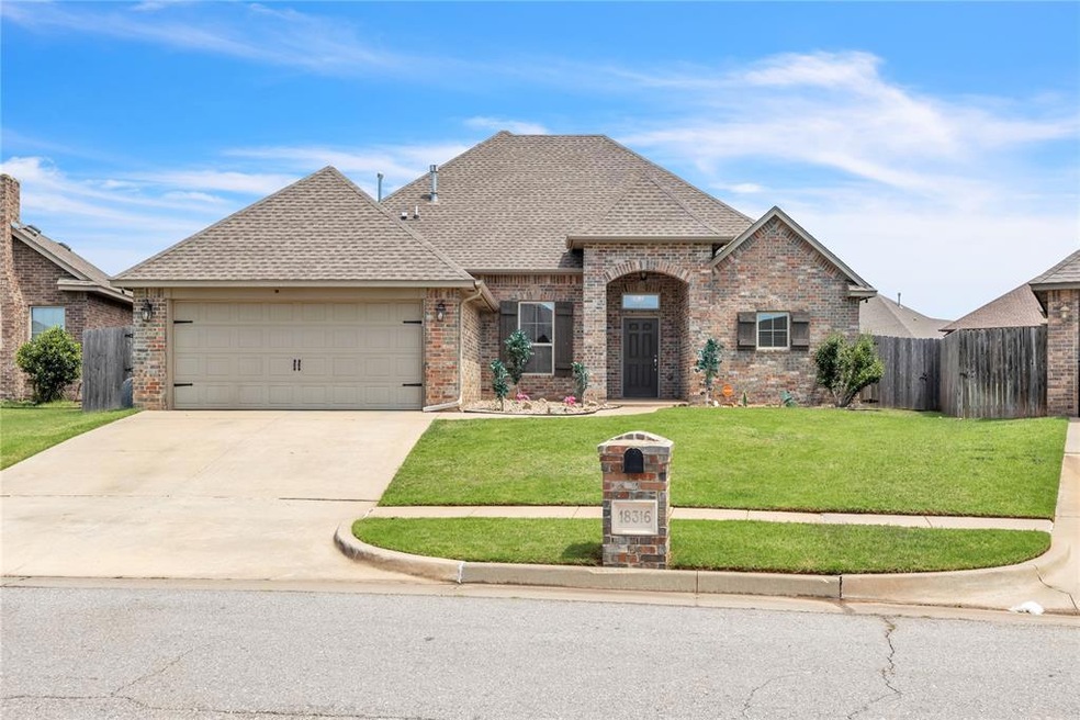 View of front facade with a garage and a front yard