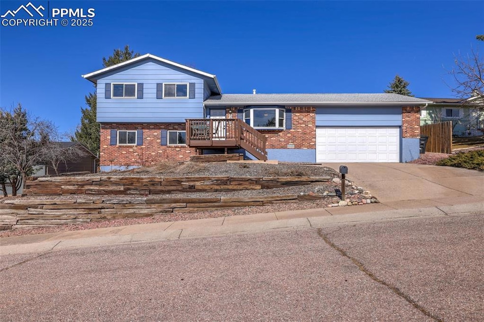 Split level home featuring brick siding, stairway,