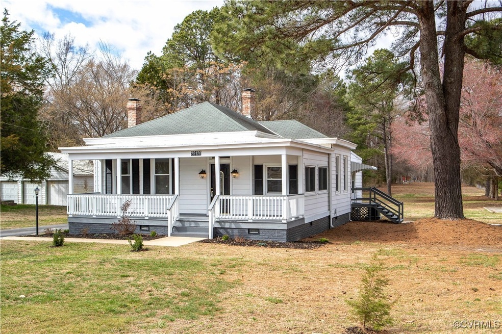View of front of home featuring roof with shingles