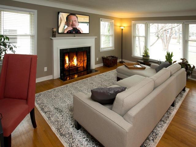 Light & bright living room with wood burning firep