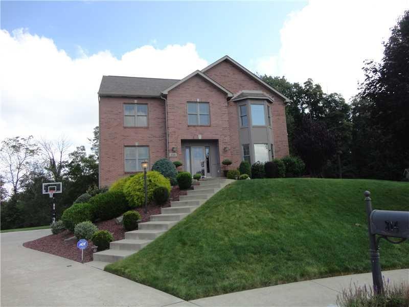 Exterior Front. You will love the level driveway.  The exceptional cul-de-sac lot that backs to woods will delight your most discerning buyers.