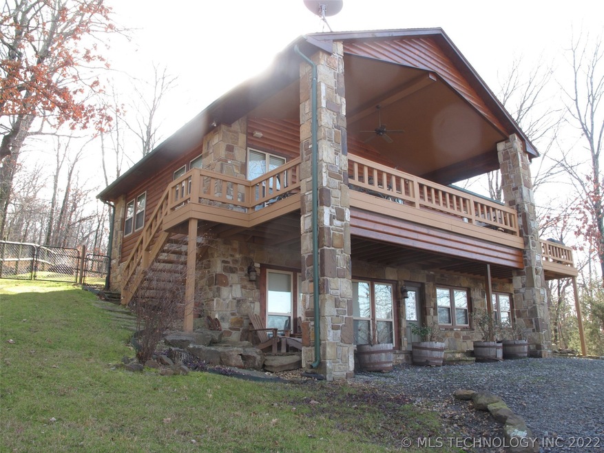 Native stone foundation and 2 story columns.