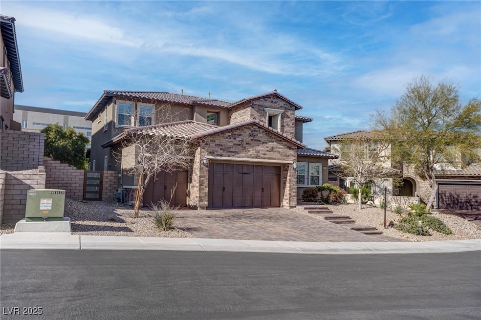 Mediterranean / spanish-style house featuring a ti