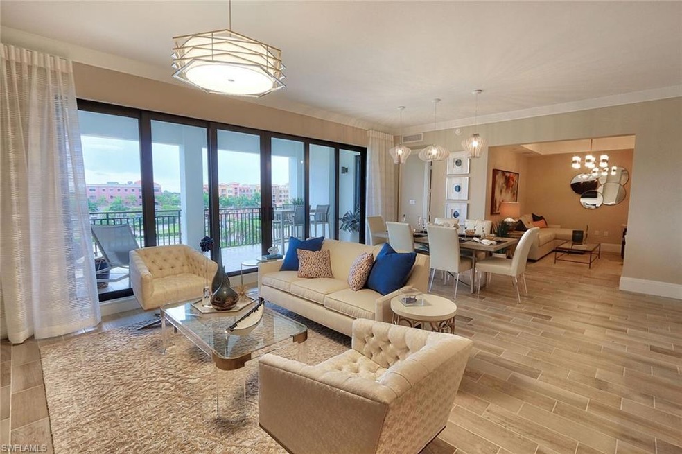 Living area featuring french doors, baseboards, an