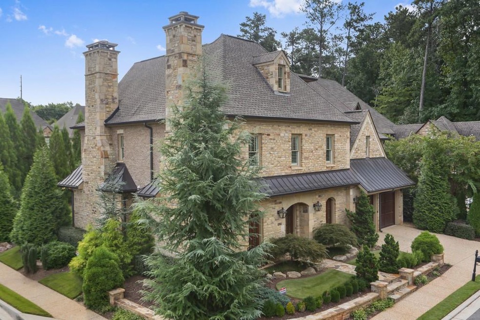 This stunning custom brick and stone highly appoin