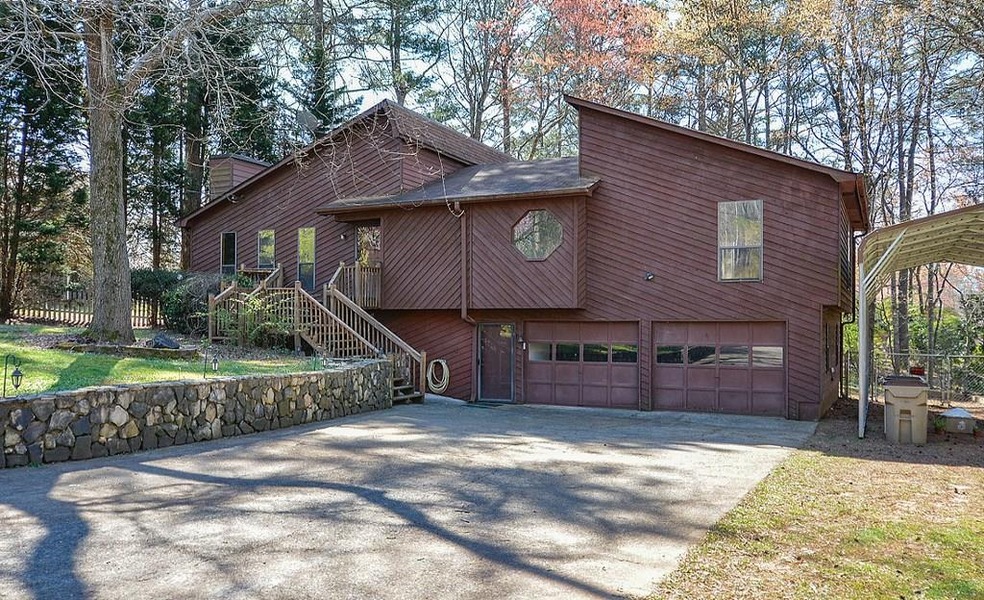 Front view - with beautiful stone wall.