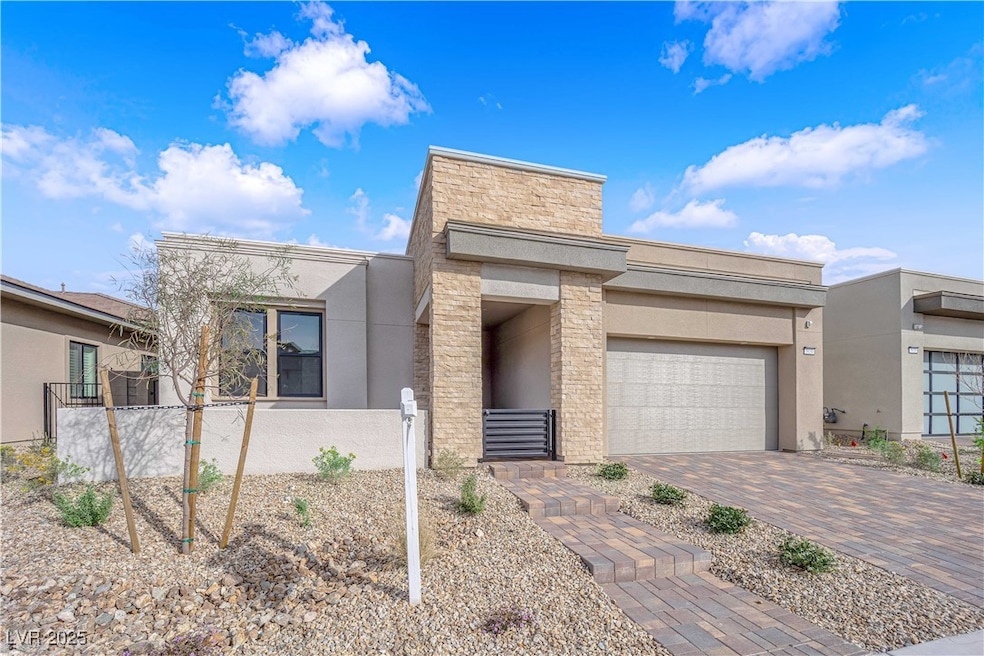 Contemporary house featuring stucco siding, an att