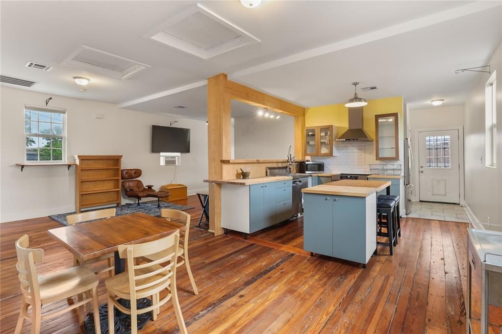 Dining and kitchen area with living room in the ba