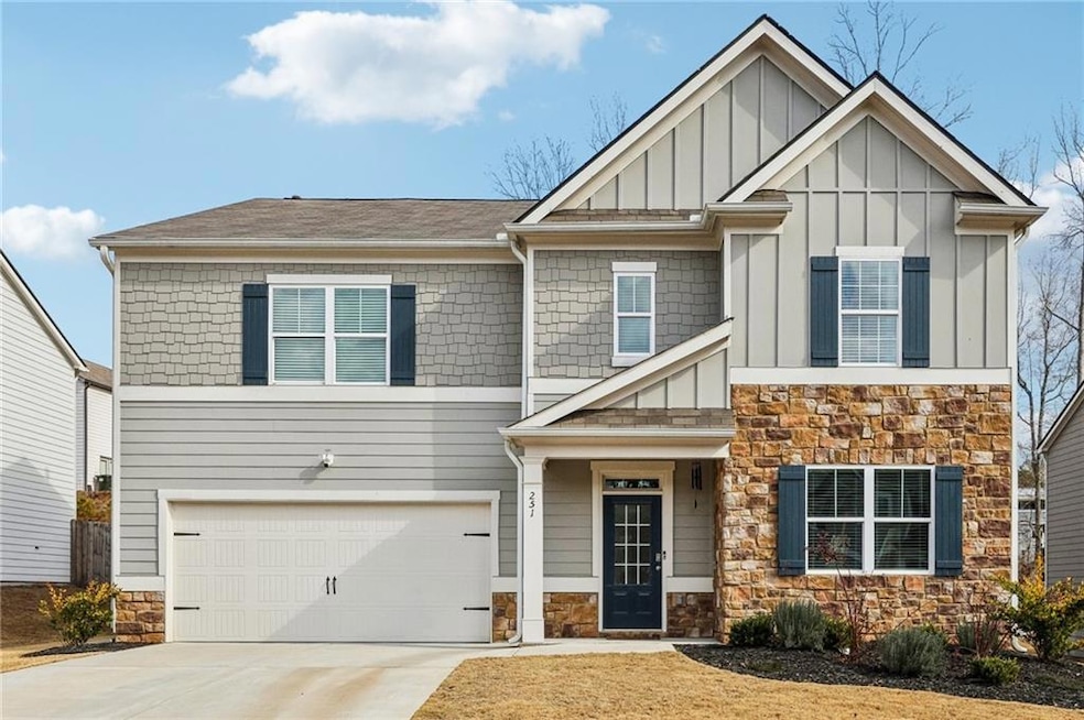 Craftsman-style house featuring a garage