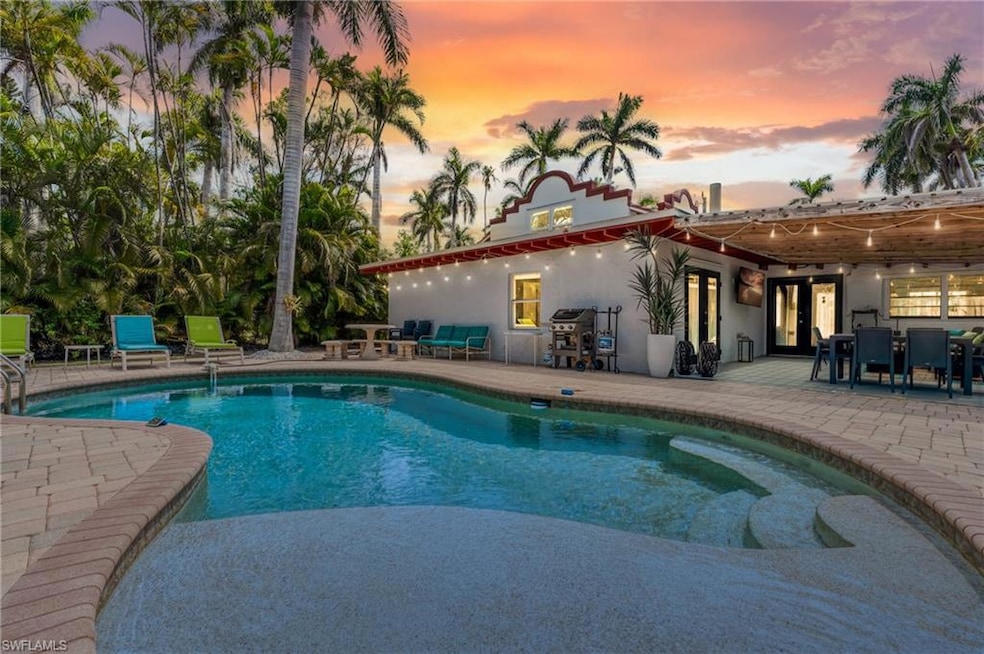 Swimming pool with a patio and outdoor dining area