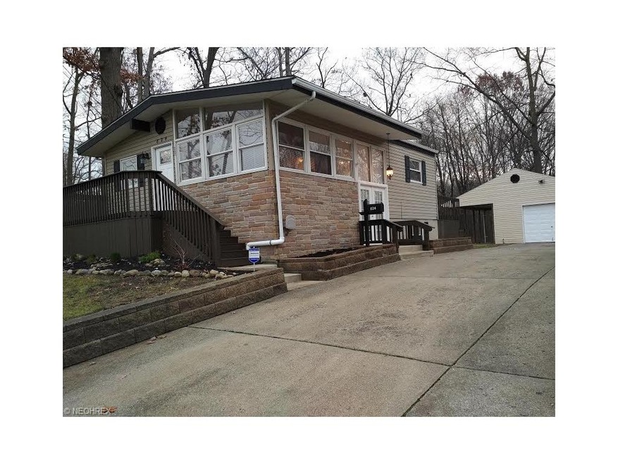Concrete drive with one+ car garage with overhang 