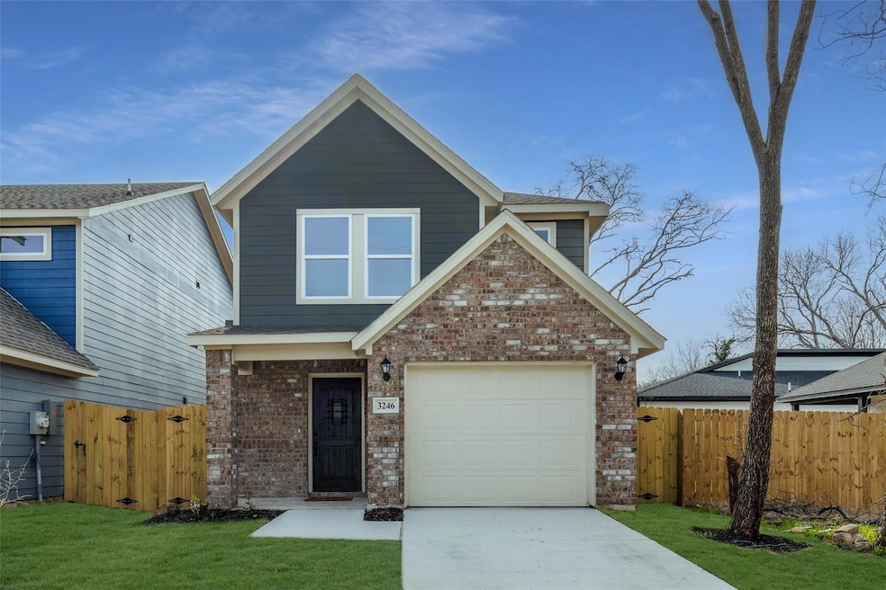 View of front of property with brick siding, concr