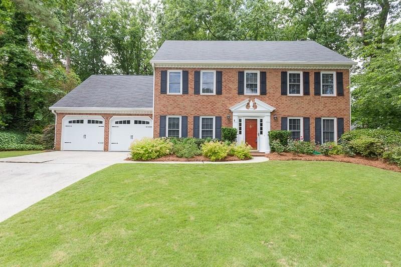 Beautifully maintained brick home with fabulous ya