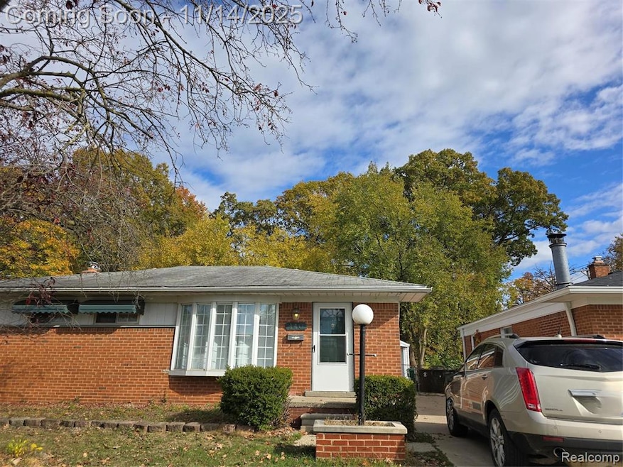View of front of house with brick siding