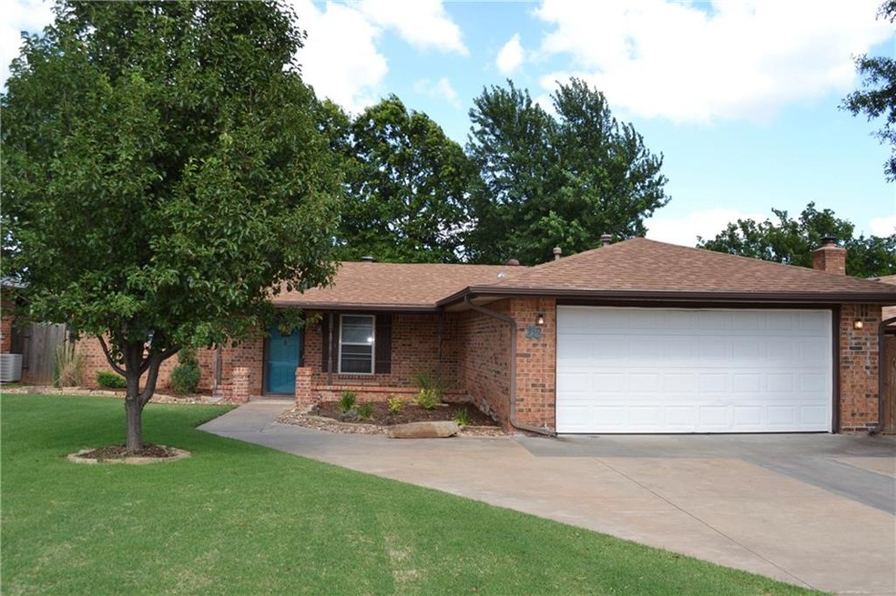 Front of home with beautiful landscaping and view 