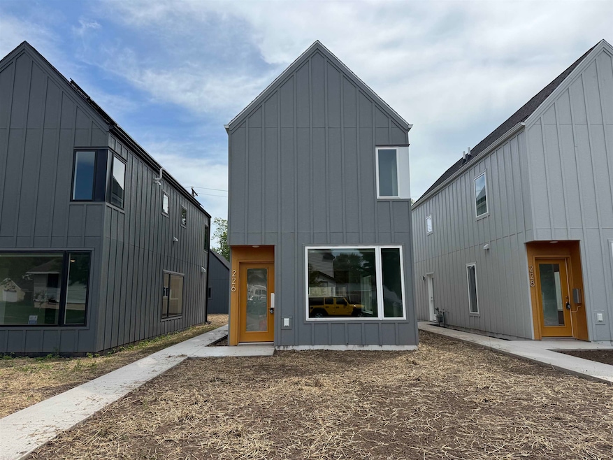 Rear view of property featuring board and batten siding