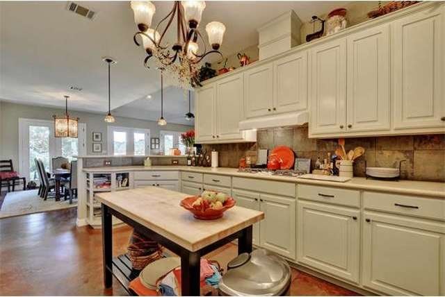 Kitchen has plenty of cabinets for storage and cou