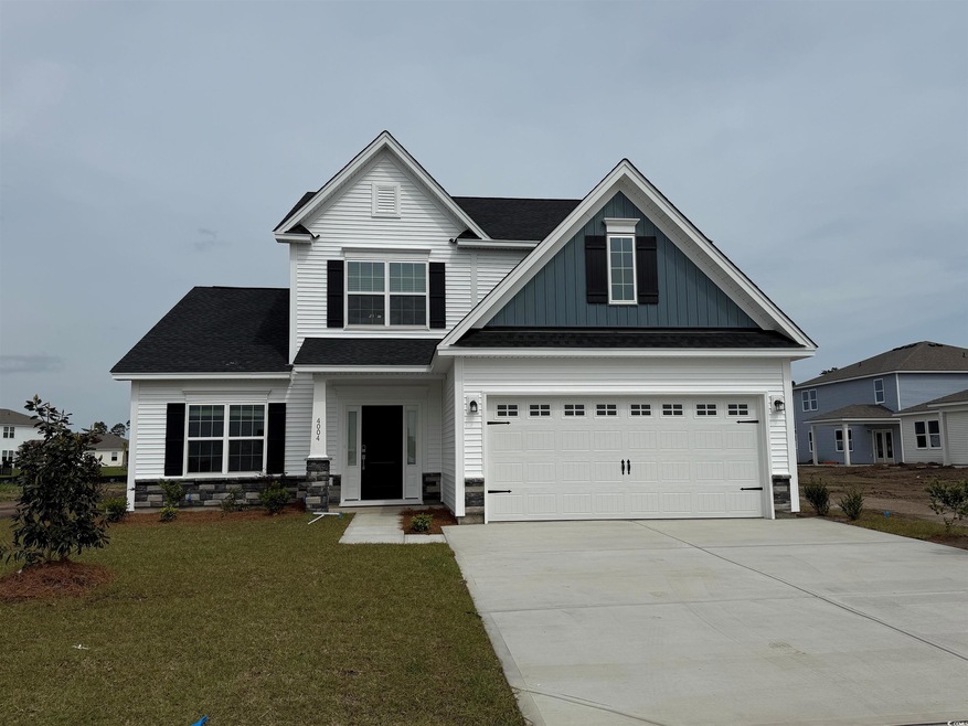 Craftsman-style home featuring board and batten si
