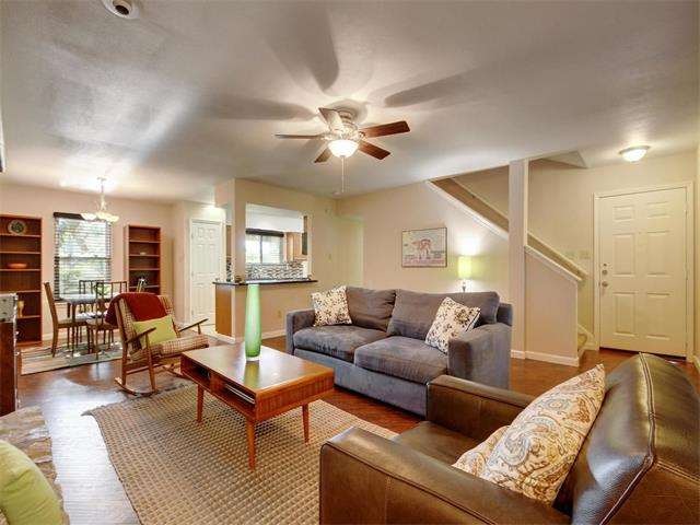 Family room with wide plant laminate flooring, cei