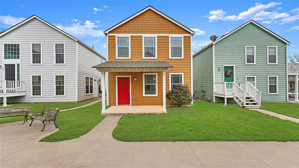 Traditional-style house with a front yard