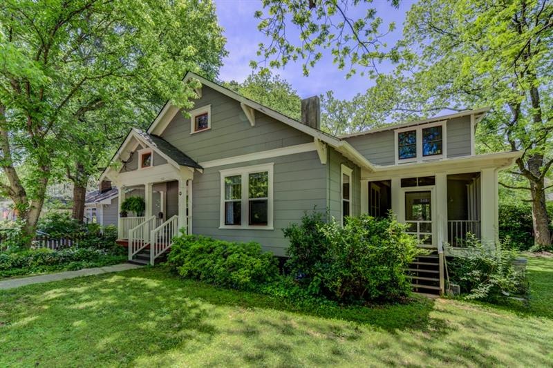 Side screen porch overlooks lush side yard!