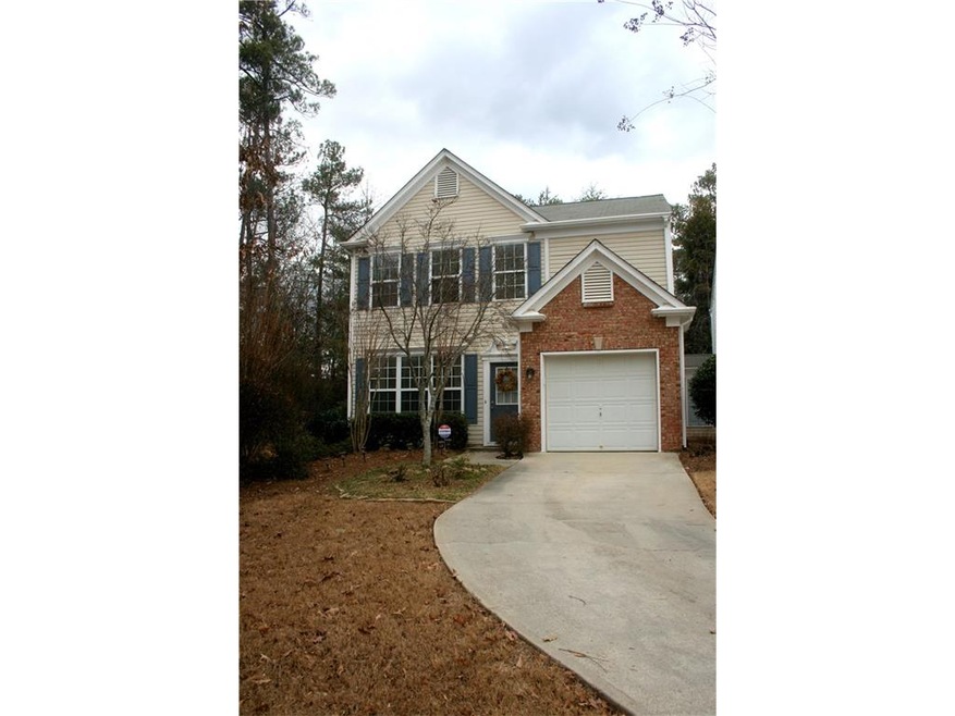 End unit with driveway that easily accommodates 2 