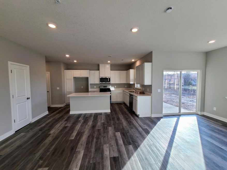 Fairfax Kitchen shown with white cabinets and quartz countertops. Photo is of actual home.