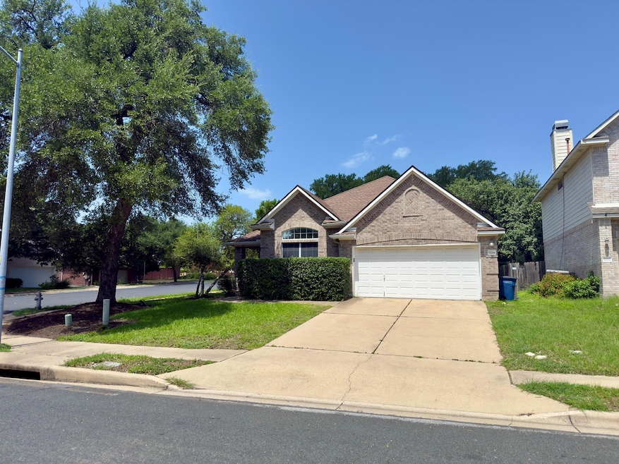 View of front of property with a front lawn, driv
