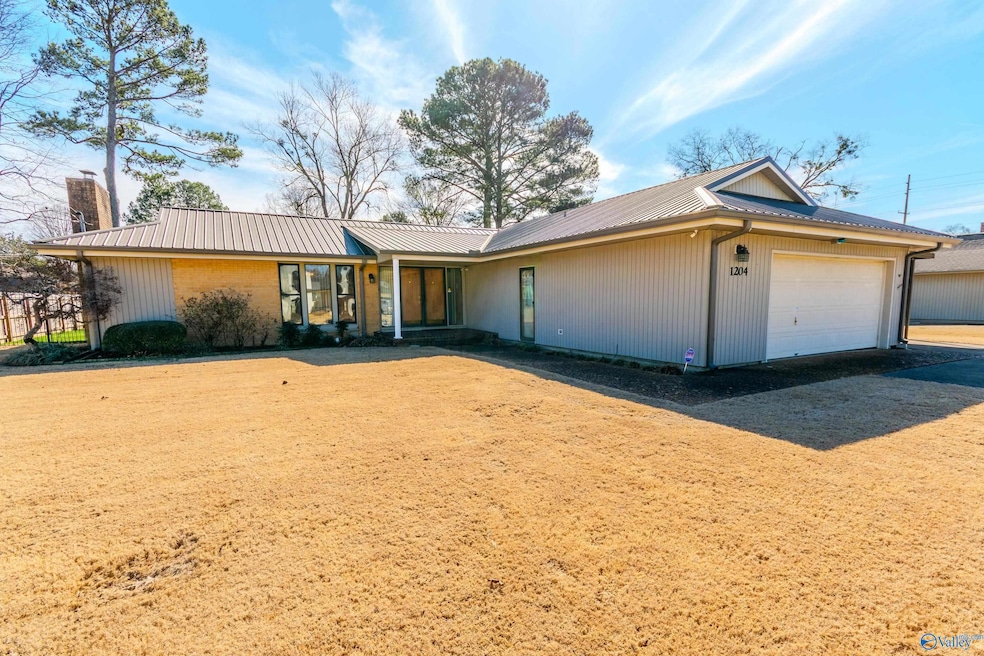 LOCATION LOCATION LOCATION FOR GREAT PRICE!!  SEE THIS 3 BR/2B HOME LOCATED ACROSS STREET FROM GOLF COURSE. 2 CAR ATTACHED GARAGE, PLUS CARPORT.  IN ADDITION THERE IS A DETACHED WORKSHOP HEATED & COOLED W/ ANOTHER CARPORT.