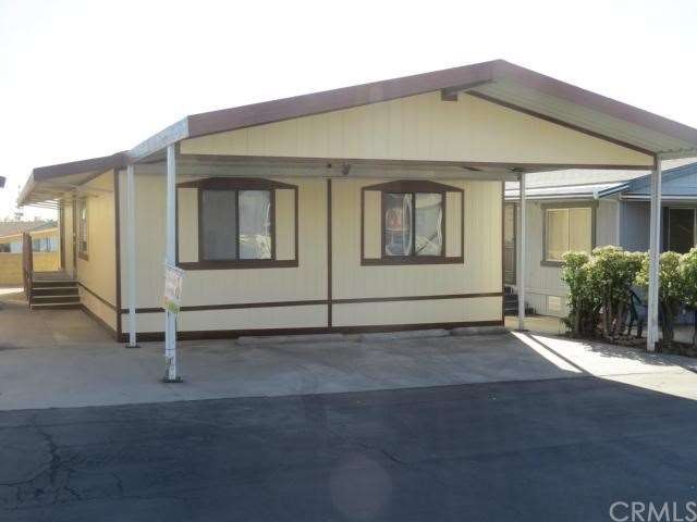 Front of Home w/carport for 3 standard vehicles