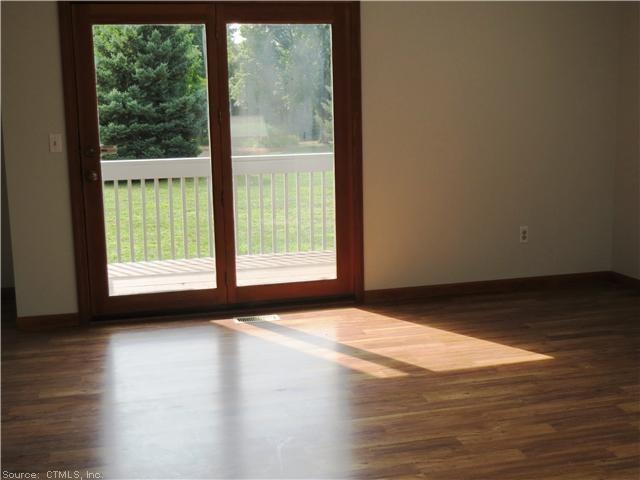 Living Room. Newer wood laminate flooring, atrium 
