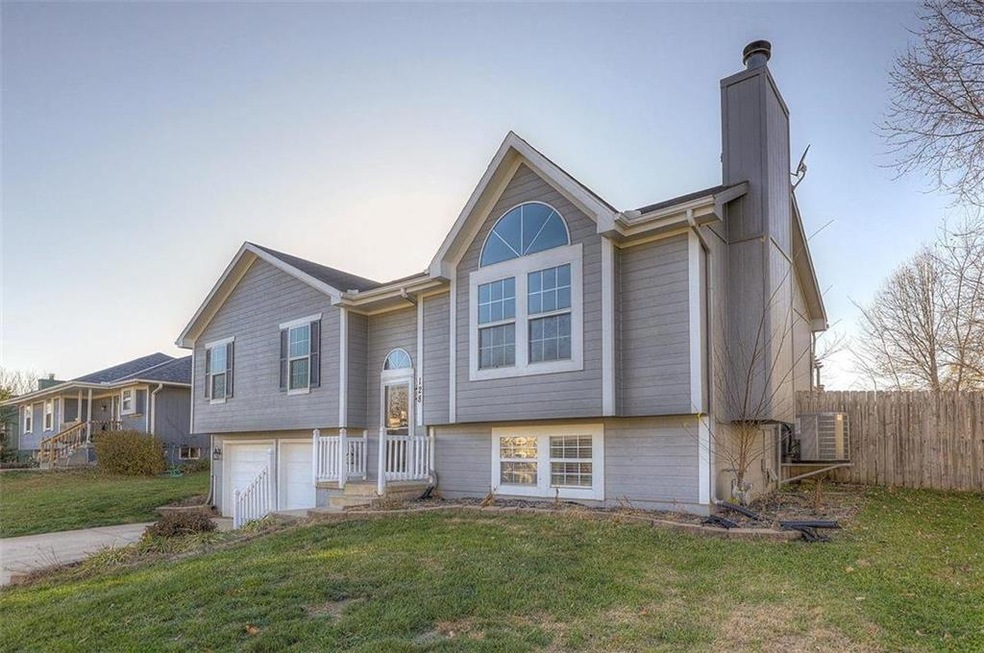 128 S Darrowby Dr, Raymore, MO 64083 - photo 1