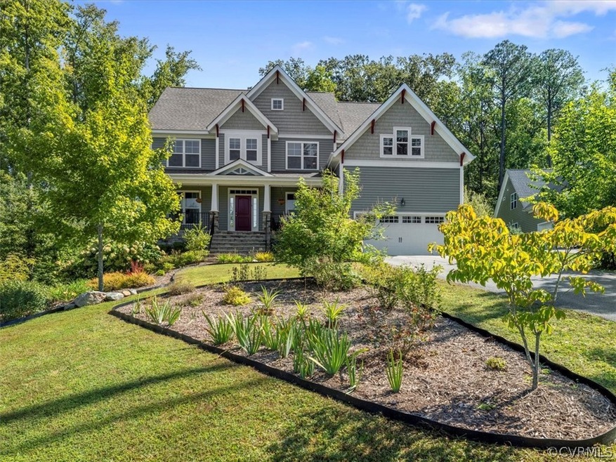 Beautiful mature landscaping welcomes you home.