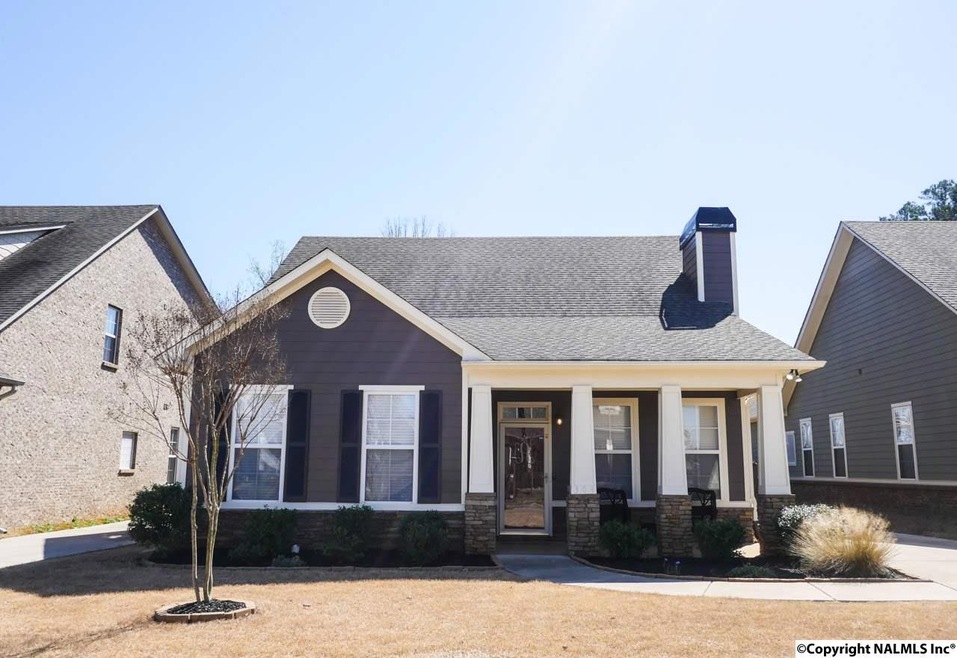 Welcome home to this darling Craftsman on Acorn Grove Lane.