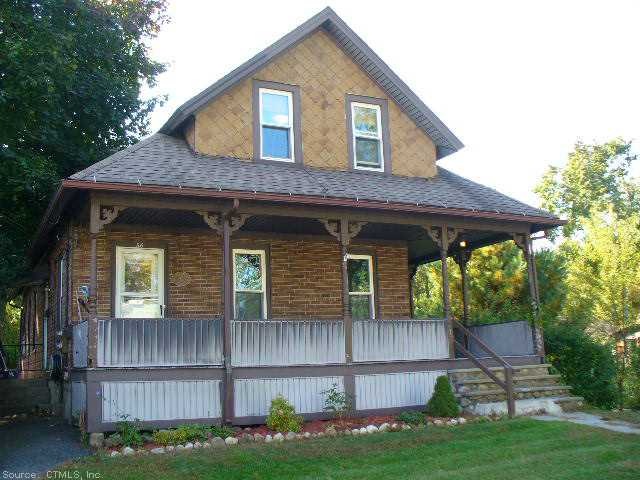 Exterior Front. Classic two family on a quiet stre