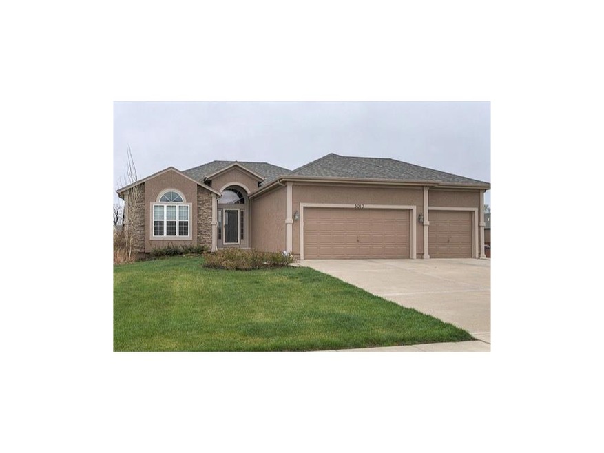 Rare three car, reverse 1.5 story Shawnee home loa