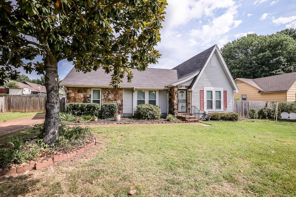 View of front of property with a front yard