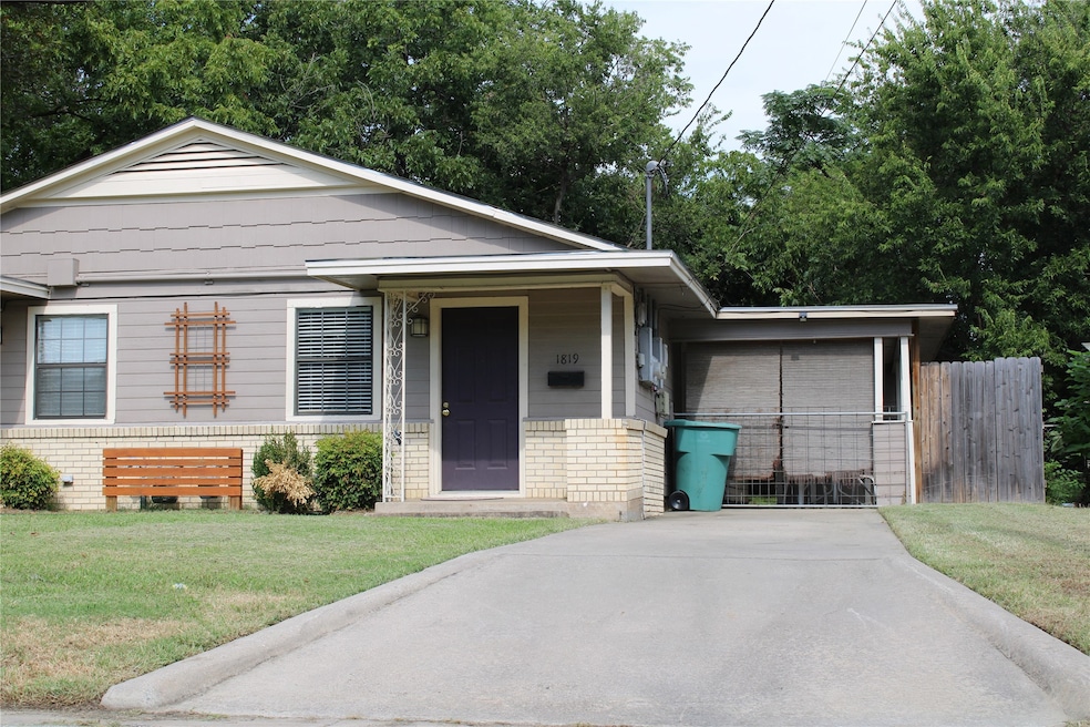 View of front of home with a porch and brick siding