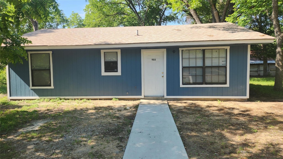 View of front of home featuring roof with shingles