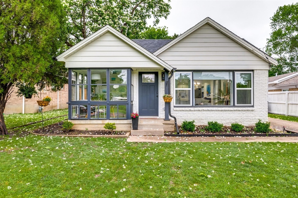 View of front of property with a front yard