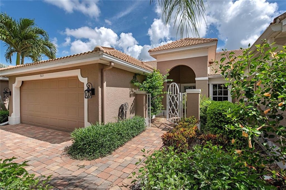 Pavers in driveway and entry walk  lead to a stunn
