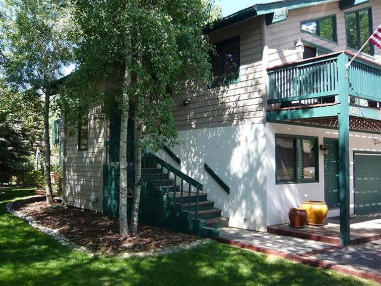 Street Exterior with deck. Man door is
