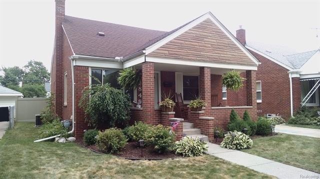 YOU WILL LOVE THE FRONT PORCH AND BEAUTIFUL LANDSC