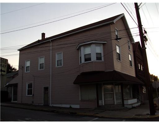 Exterior Front. Large Home on Corner lot with 3 ca